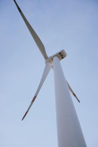 Low angle view of wind turbine against sky