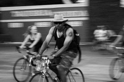 Blurred motion of people walking on road