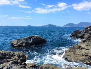 Scenic view of sea against blue sky