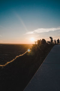 Scenic view of land against sky during sunset