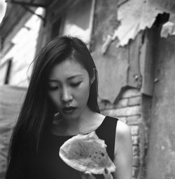 Portrait of young woman looking at camera