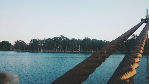 Calm sea against clear sky