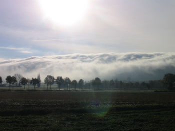 Scenic view of landscape against cloudy sky