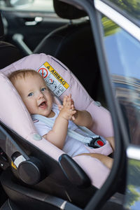 Cute baby girl in car