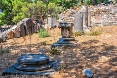 Old stone temple against trees