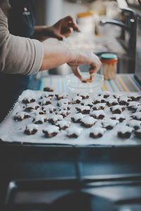 Midsection of woman preparing cookies
