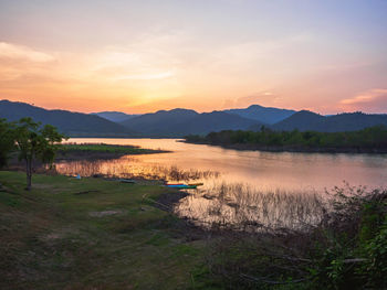 Scenic view of lake against sky during sunset