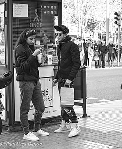 Woman standing in city