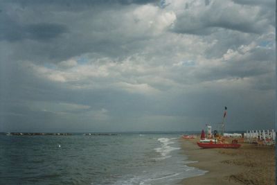 Scenic view of sea against cloudy sky