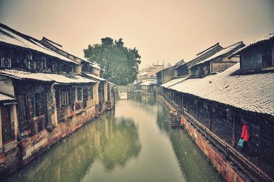 View of canal along buildings