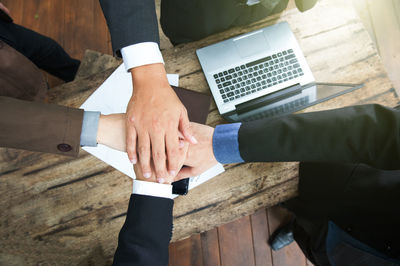 High angle view of men standing on table