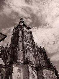 Low angle view of building against cloudy sky