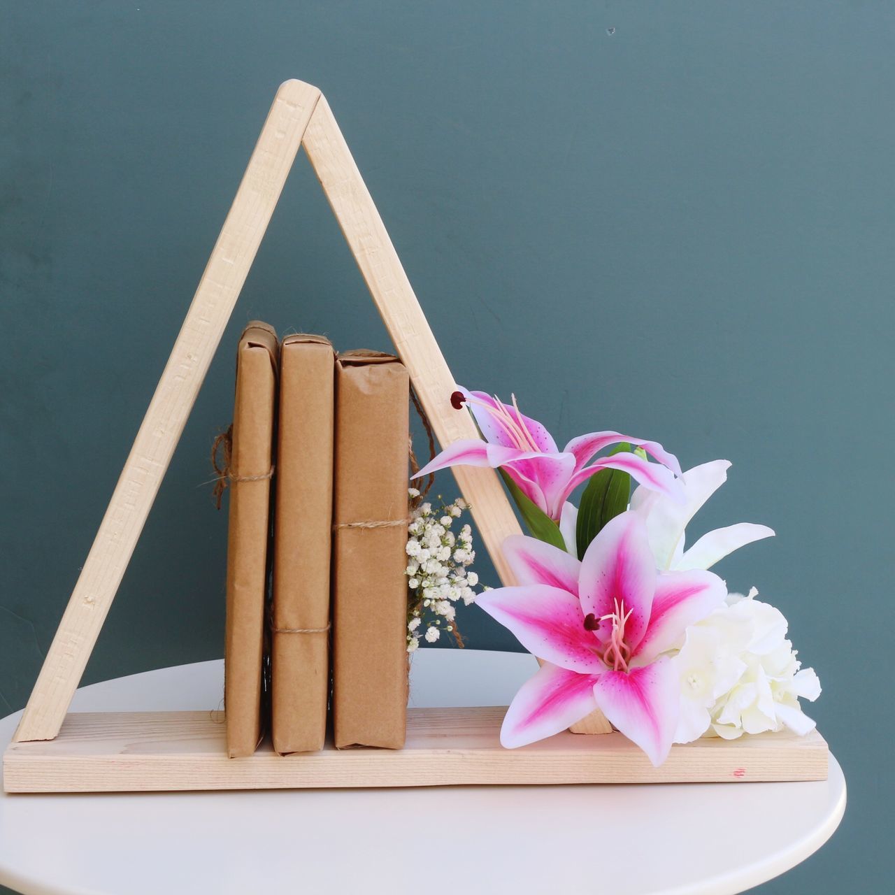 flower, pink color, no people, wood - material, table, close-up, nature, day, indoors, beauty in nature, freshness, flower head