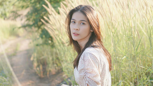 Portrait of beautiful young woman in sunlight