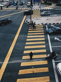 High angle view of people crossing road