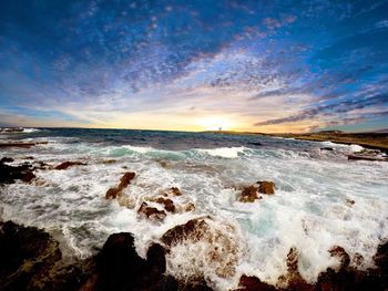 Scenic view of sea against sky during sunset