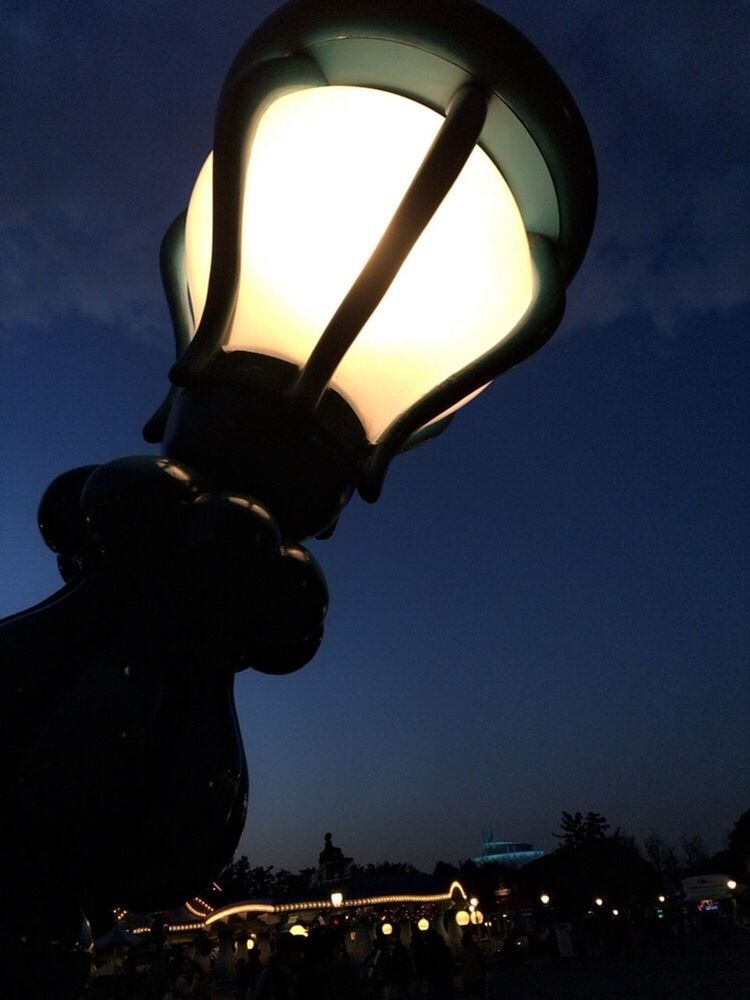 illuminated, silhouette, night, low angle view, lighting equipment, sky, arts culture and entertainment, dusk, light - natural phenomenon, glowing, music, leisure activity, dark, technology, performance, street light, men, electricity