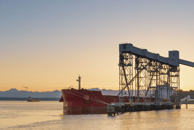 View of ship in sea against sky during sunset