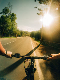 Man riding bicycle on road