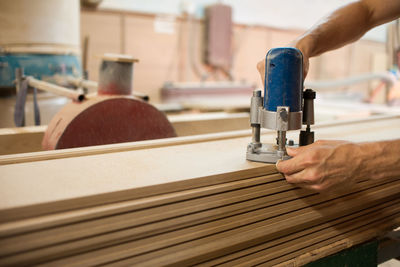 Close-up of man working at machine