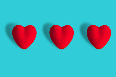 Close-up of heart shape against blue background