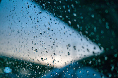 Close-up of water drops on glass window