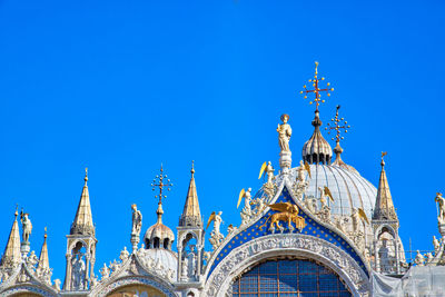 Low angle view of building against blue sky