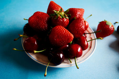 High angle view of strawberries in plate on table