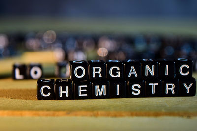 Close-up of information sign on table