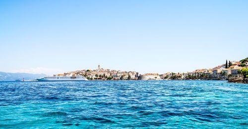 Scenic view of sea against clear blue sky