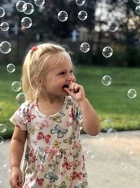 Girl blowing bubbles