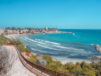 Scenic view of sea against clear blue sky