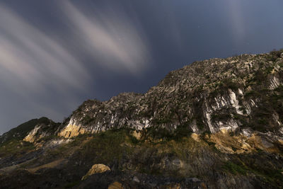 Low angle view of mountain against sky at night