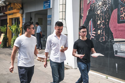 Friends walking on street