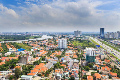 Cityscape against cloudy sky