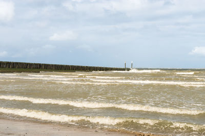 Scenic view of beach against sky