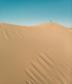 Scenic view of desert against clear sky