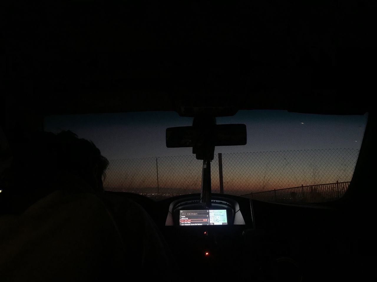 SILHOUETTE OF CAR AGAINST SKY