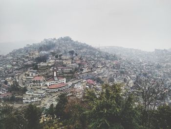 Aerial view of cityscape against clear sky