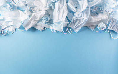 High angle view of blue paper over white background