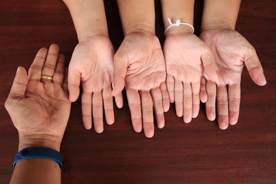 Midsection of couple hands