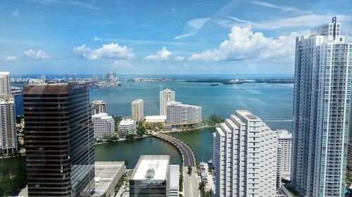 High angle view of modern buildings by biscayne bay against sky