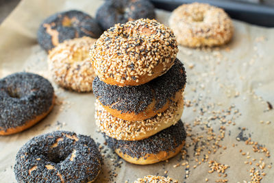 Freshly baked sesame and poppy seeded bagels. close up.