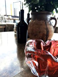 Close-up of wine bottles on table