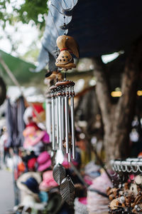 Close-up of wind chime hanging for sale in market