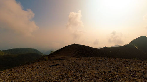 Scenic view of mountains against sky during sunset