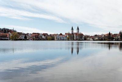 Lake with buildings in background