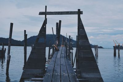 Pier on jetty against sky