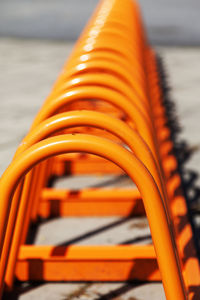 Close-up of yellow metallic railing against sea