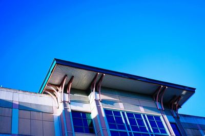 Low angle view of building against clear blue sky